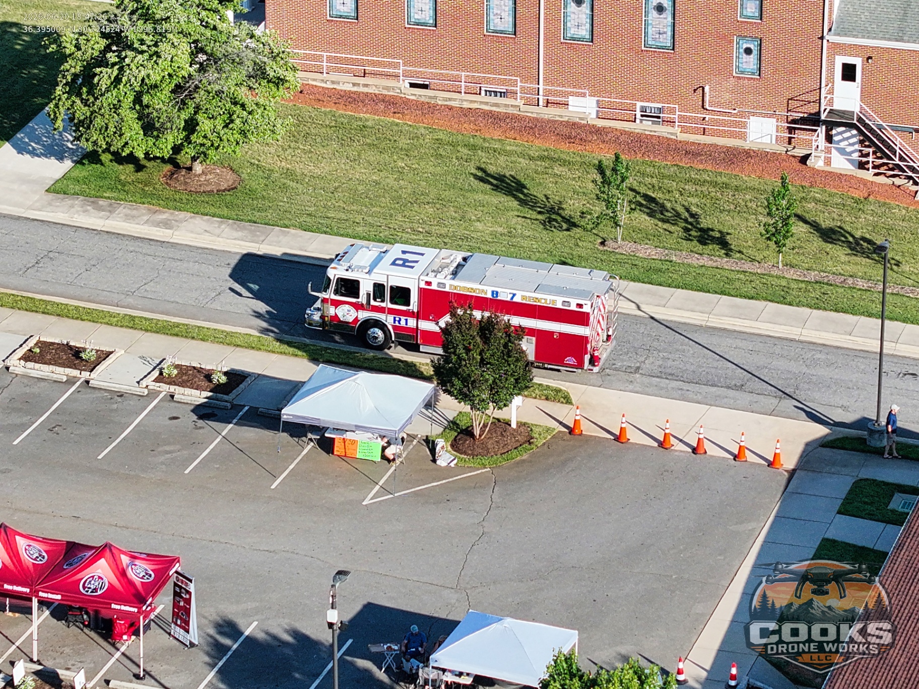 Aerial photo of a rescue truck staged beside a community event