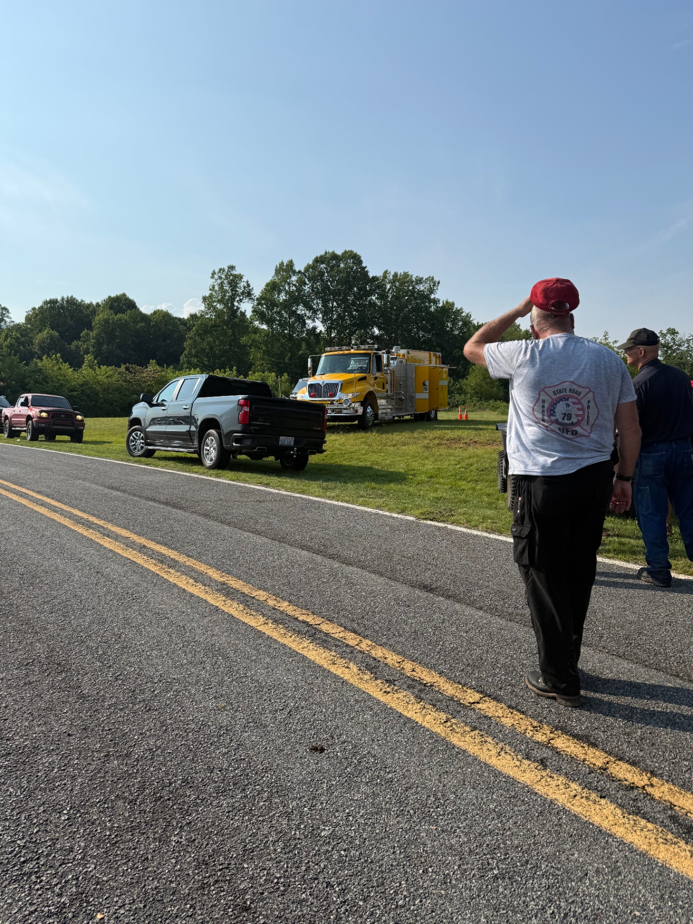 Fire truck and command vehicles staged at a recovery scene