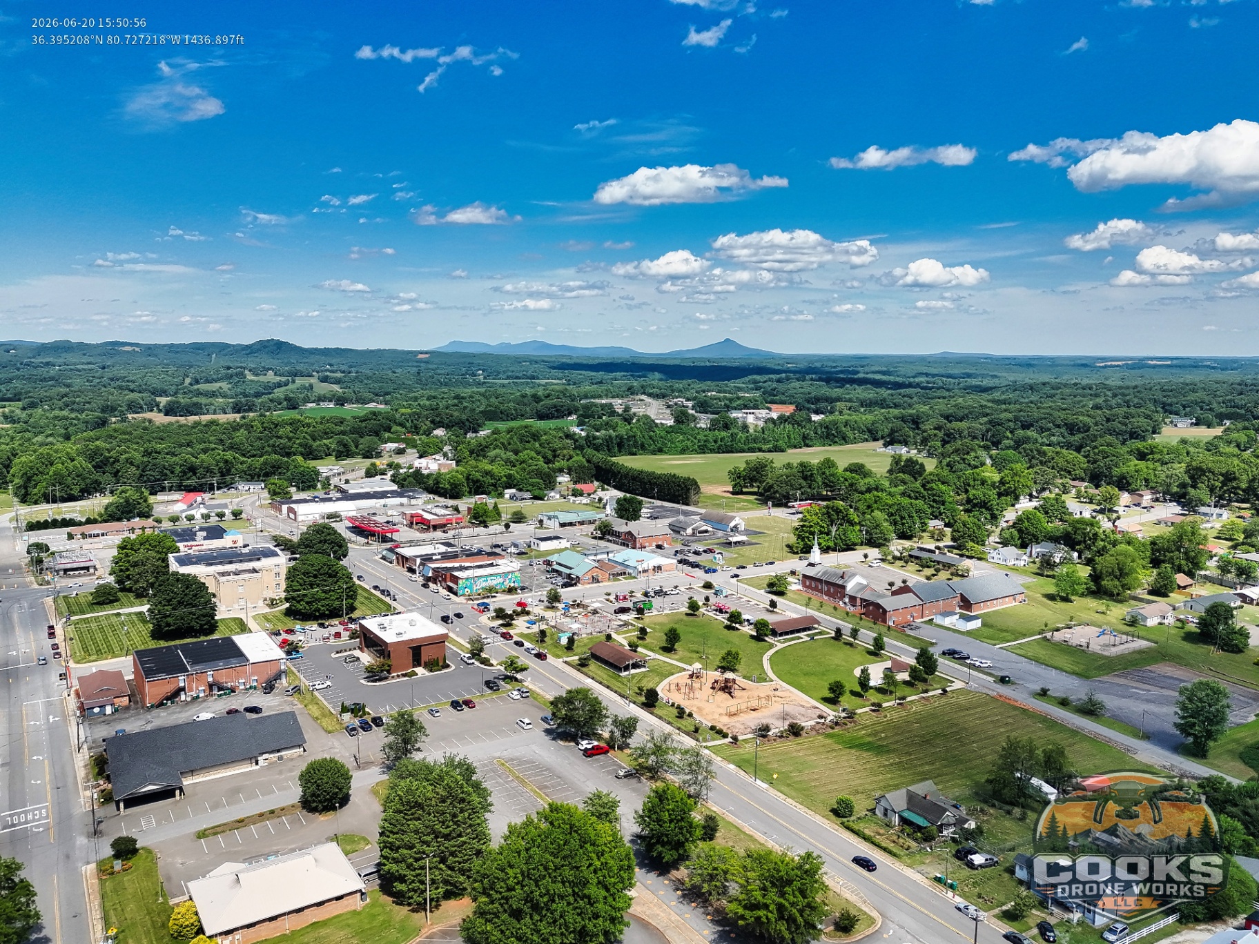 Wide aerial view of downtown Dobson with the mountains in the distance