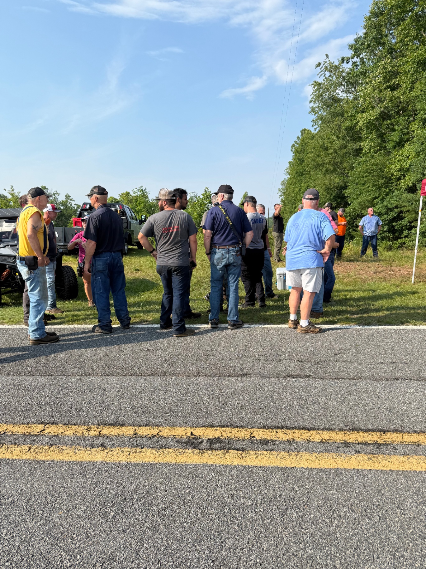 Search team gathered roadside during a recovery mission